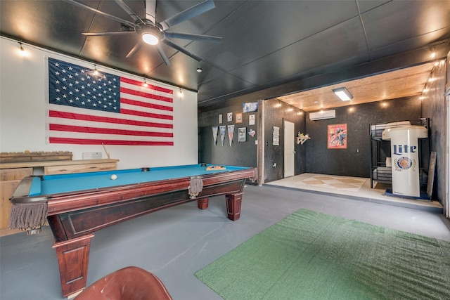 playroom with finished concrete flooring, an AC wall unit, pool table, a ceiling fan, and water heater