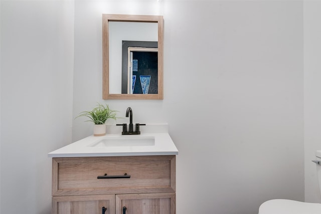 half bath with vanity and toilet