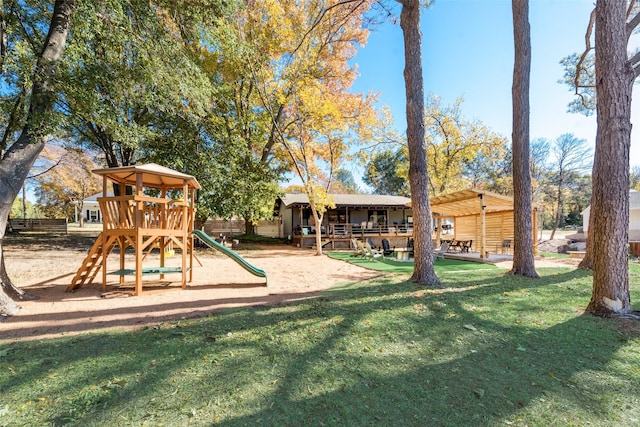community playground with fence and a yard