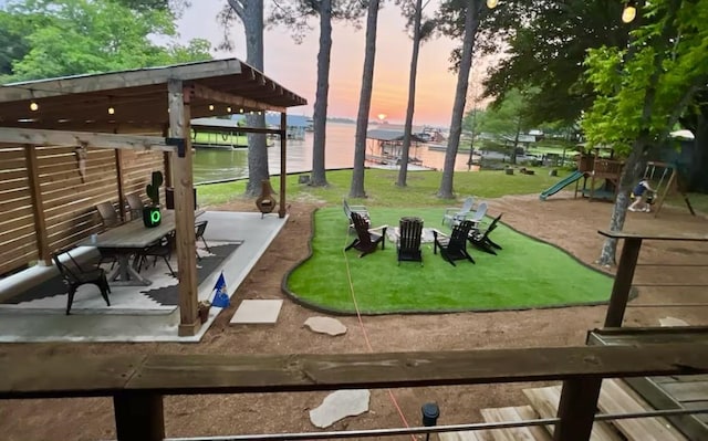 164 Redondo Rd, Gun Barrel City, TX 75156 - playground at dusk featuring a water view and a playground