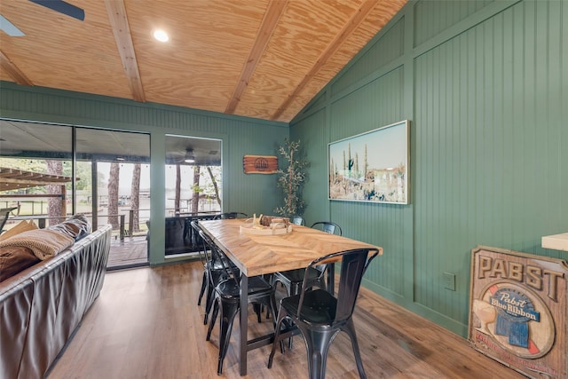 dining space featuring wooden ceiling, lofted ceiling with beams, a ceiling fan, and wood finished floors