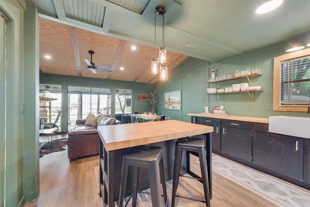 164 Redondo Rd, Gun Barrel City, TX 75156 - kitchen with butcher block counters, light wood-style floors, a ceiling fan, a sink, and pendant lighting