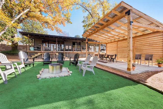 back of property with an outdoor fire pit, a patio area, and ceiling fan
