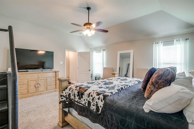 carpeted bedroom with lofted ceiling and a ceiling fan