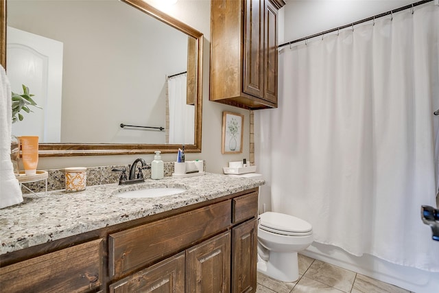 full bath with tile patterned floors, vanity, and toilet