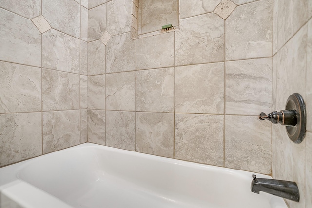 interior details with a bathing tub and walk in shower