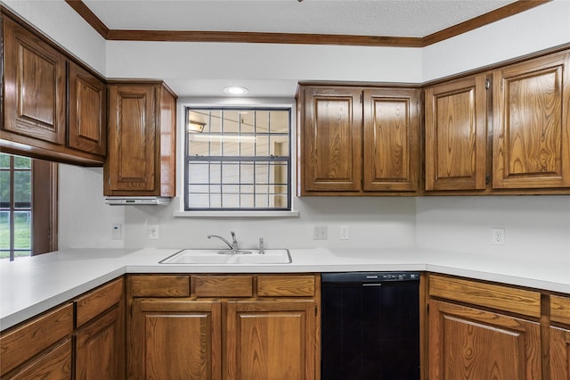 kitchen featuring ornamental molding, dishwasher, light countertops, and a sink