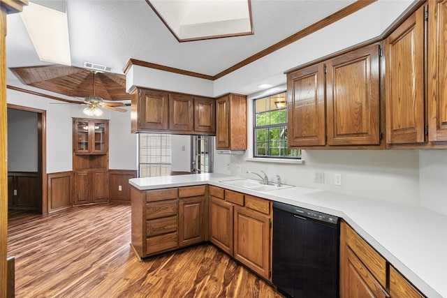 kitchen with a sink, visible vents, freestanding refrigerator, dishwasher, and dark wood finished floors