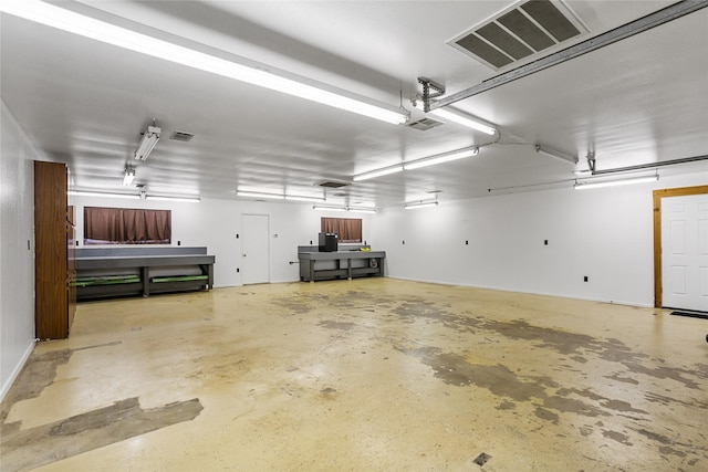 garage with visible vents and a garage door opener