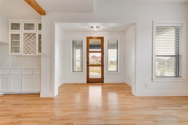 1001 Devoss Ct, Caddo Mills, TX 75135 - foyer entrance with beamed ceiling, baseboards, and light wood-type flooring