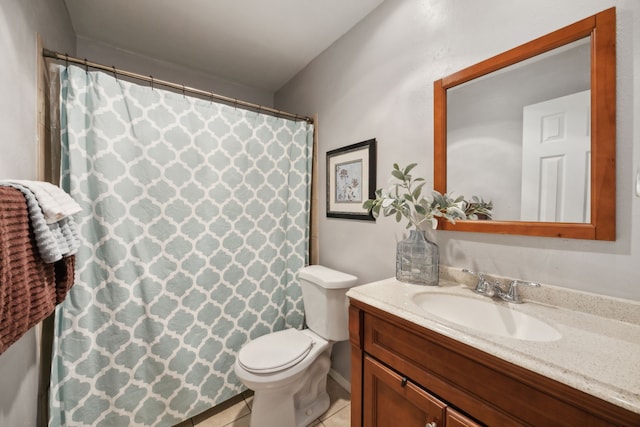 bathroom featuring vanity, tile patterned floors, toilet, and curtained shower