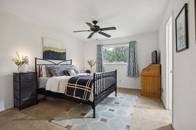 bedroom with carpet floors, baseboards, and ceiling fan