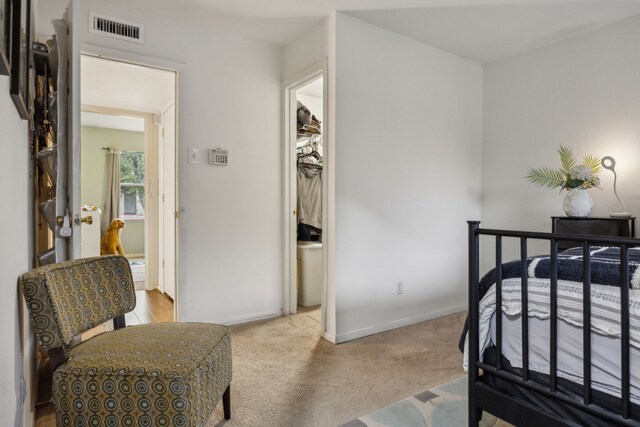 bedroom featuring carpet floors, baseboards, and visible vents
