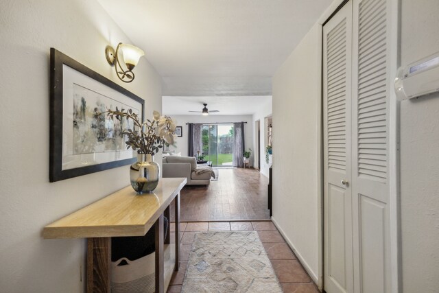 corridor featuring light tile patterned floors