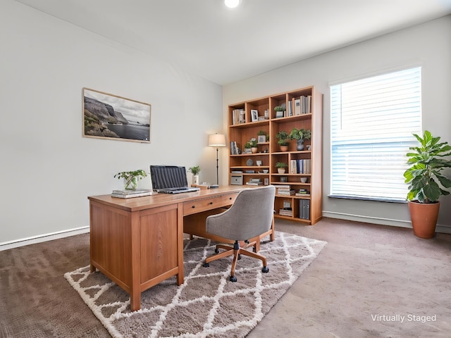 carpeted office with baseboards