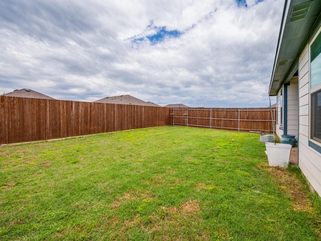 view of yard featuring a fenced backyard