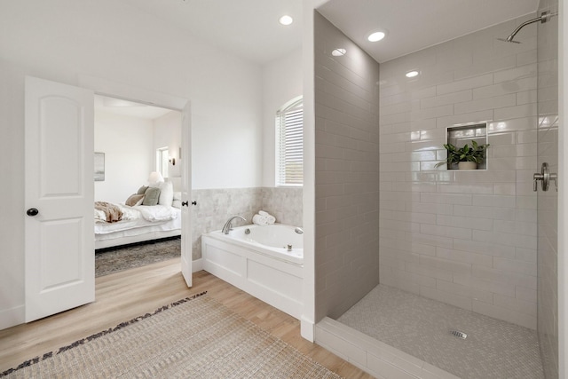 full bathroom featuring recessed lighting, wood finished floors, connected bathroom, a stall shower, and a garden tub