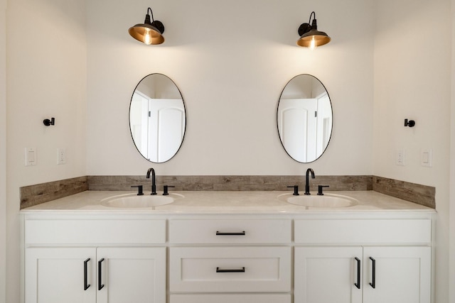 bathroom featuring double vanity and a sink