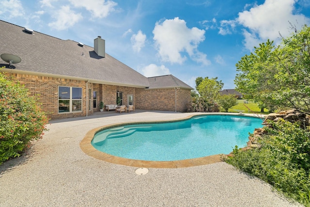 pool featuring a patio area