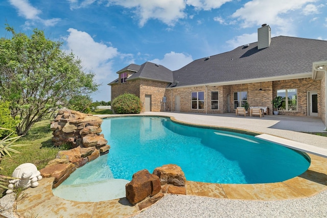pool with a patio area