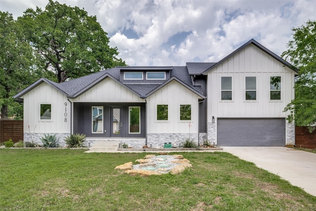 modern farmhouse style home featuring concrete driveway, board and batten siding, a shingled roof, a front yard, and an attached garage