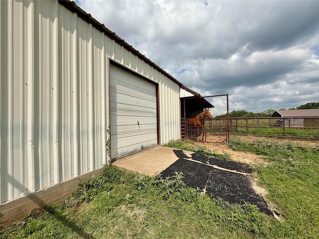 garage with fence