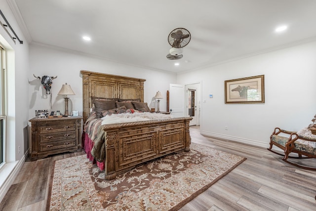 11900 Wind Hollow Ct, Tolar, TX 76476 - bedroom featuring crown molding, light wood finished floors, baseboards, recessed lighting, and a barn door