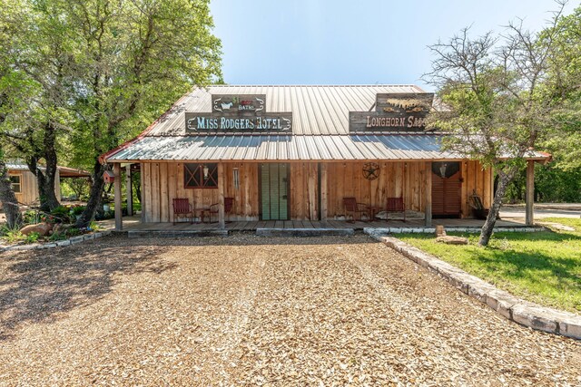 11900 Wind Hollow Ct, Tolar, TX 76476 - view of front of home with a porch and board and batten siding