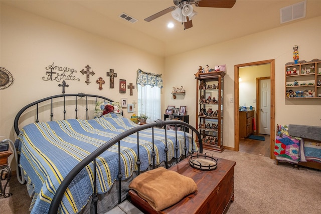 bedroom with visible vents, ceiling fan, and carpet floors