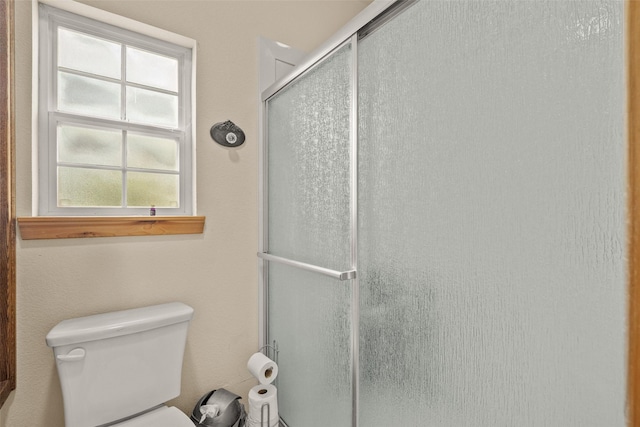 full bath with an enclosed shower and toilet