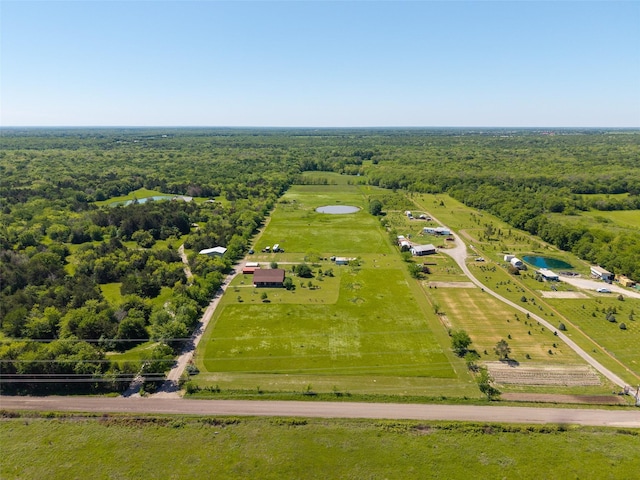aerial view with a rural view and a view of trees