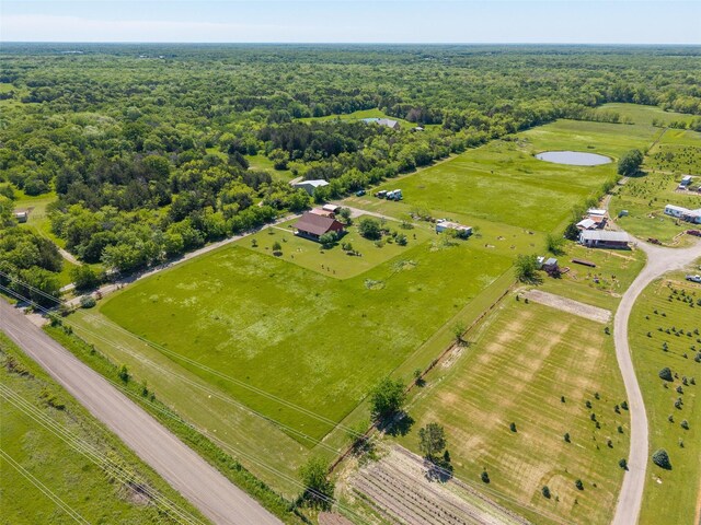 drone / aerial view with a rural view and a forest view