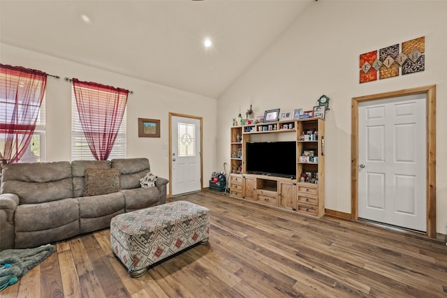 living area featuring recessed lighting, high vaulted ceiling, and hardwood / wood-style floors
