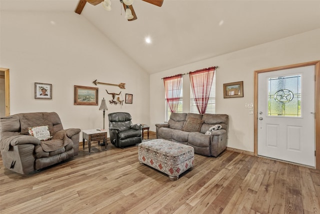 living room featuring light wood finished floors, recessed lighting, high vaulted ceiling, a ceiling fan, and baseboards