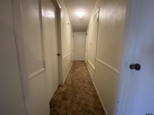 hall featuring baseboards