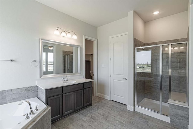 3406 Tilley Ct, Rockwall, TX 75087 - bathroom with a shower stall, a bath, and vanity