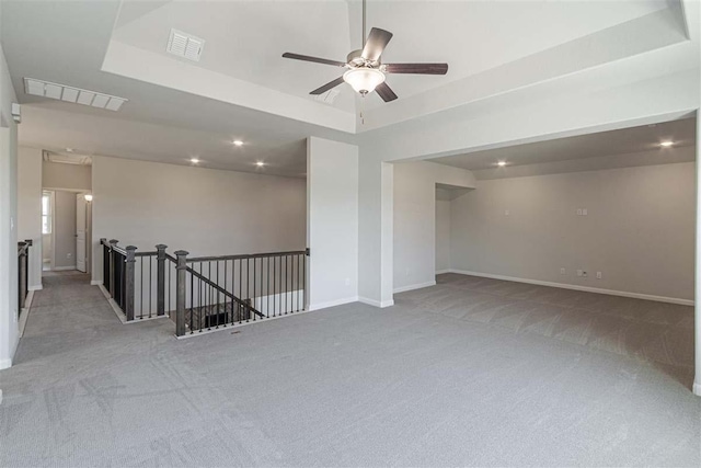 3406 Tilley Ct, Rockwall, TX 75087 - carpeted spare room with a tray ceiling, ceiling fan, baseboards, and recessed lighting