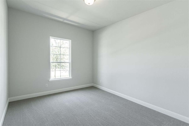 3406 Tilley Ct, Rockwall, TX 75087 - carpeted spare room featuring baseboards