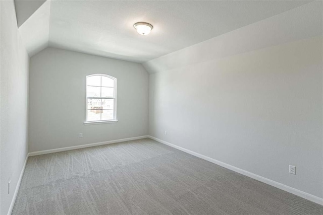 3406 Tilley Ct, Rockwall, TX 75087 - bonus room featuring vaulted ceiling, carpet, and baseboards