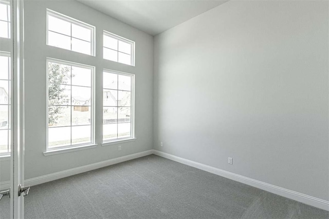 3406 Tilley Ct, Rockwall, TX 75087 - spare room featuring carpet and baseboards