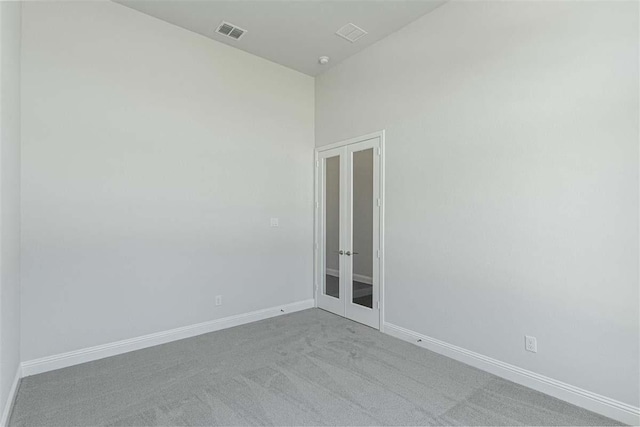 3406 Tilley Ct, Rockwall, TX 75087 - empty room featuring french doors, carpet floors, and baseboards