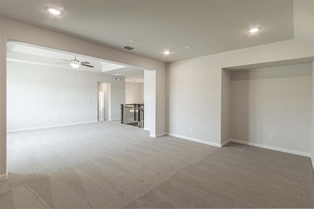 unfurnished living room featuring recessed lighting, ceiling fan, visible vents, light carpet, and baseboards