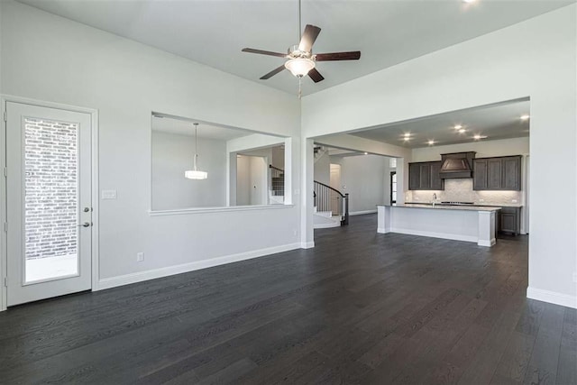 3406 Tilley Ct, Rockwall, TX 75087 - unfurnished living room with dark wood-type flooring, a ceiling fan, baseboards, stairway, and recessed lighting