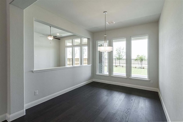 3406 Tilley Ct, Rockwall, TX 75087 - unfurnished dining area featuring baseboards, dark wood-type flooring, and ceiling fan