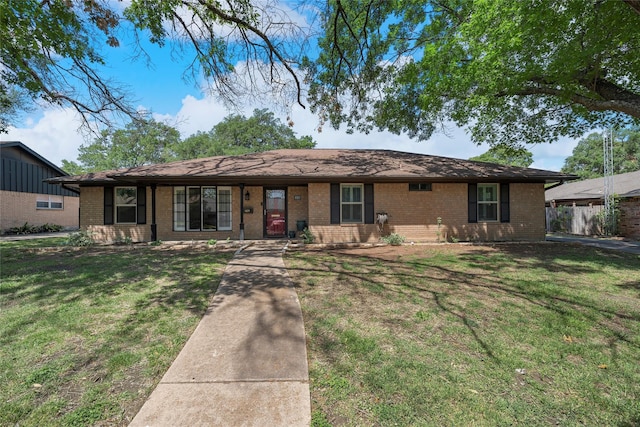 4919 Lake Arrowhead Dr, Waco, TX 76710 - ranch-style home featuring fence, a front yard, and brick siding