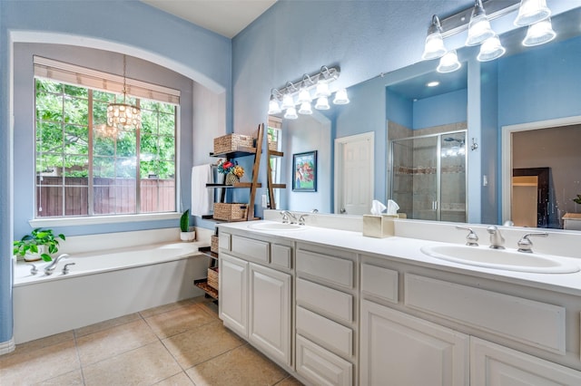 881 Willowmist Dr, Prosper, TX 75078 - bathroom featuring a shower stall, double vanity, a garden tub, tile patterned flooring, and a chandelier