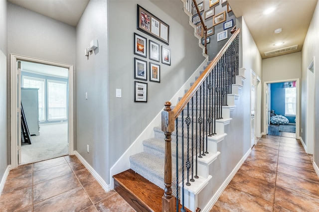 881 Willowmist Dr, Prosper, TX 75078 - stairs featuring tile patterned floors and baseboards