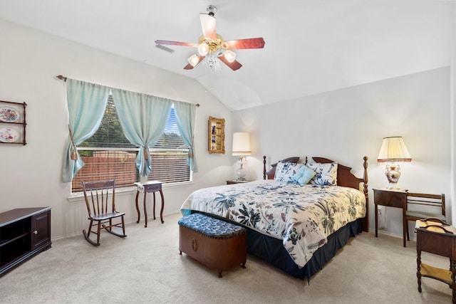 carpeted bedroom featuring visible vents, ceiling fan, vaulted ceiling, and baseboards