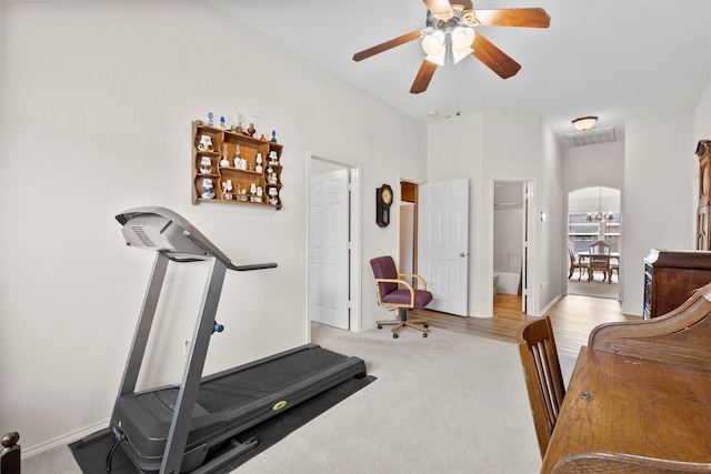 workout area with a ceiling fan, visible vents, carpet floors, and baseboards