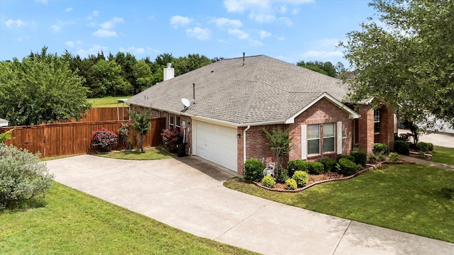 single story home with driveway, fence, a front lawn, brick siding, and a garage